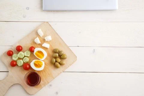 Tea and Turkish,Mediterranean Breakfast on a light wooden tray on a white nat Stock Photos