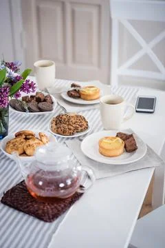 Tea and various pastry Stock Photos