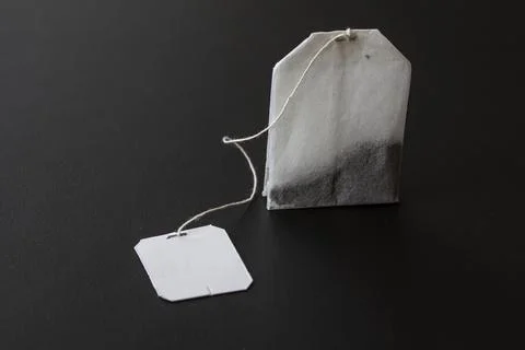 Tea bag on black background. Close up image. Stock Photos