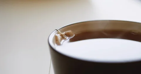 Tea bag is brewed in a mug 스톡 동영상 105176024