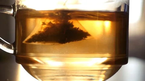 Tea bag in a cup chatting upside down. HD, 1920x1080, slow motion Stock Footage 123369158