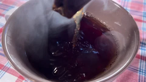 Tea bag dipped in the cup with hot water Stock Footage 220740695