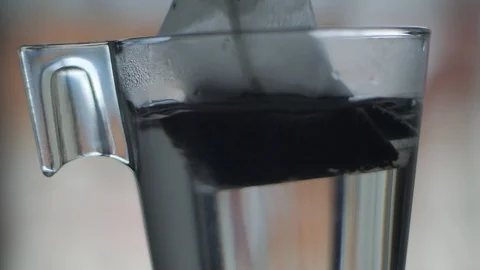 Tea bag in glass cup slow motion Stock-Footage 116676906