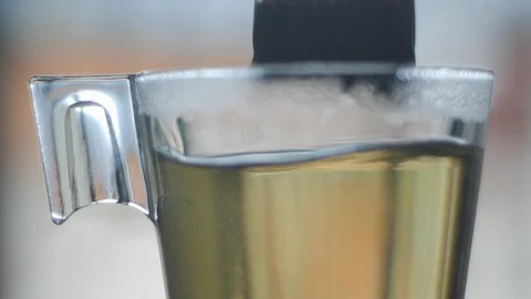 Tea bag in glass cup slow motion Stock Footage 116677007