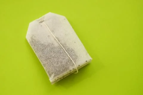 Tea bag on green table, copy space Stock Photos