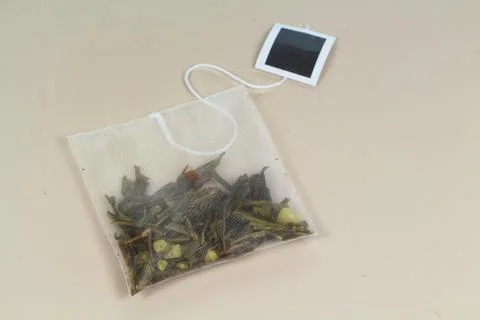 Tea bag with green tea Stock Photos