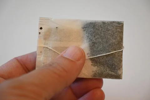 Tea Bag in Hand Calm Routine Concept Copy Space 库存照片