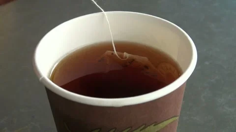 A tea bag in hot water Video stock 7749457