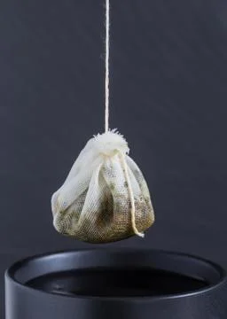 Tea bag is hung in a cup Stock Photos
