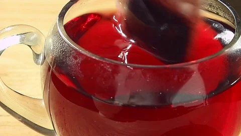 Tea bag is lowered into the cup Stock Footage 73749250