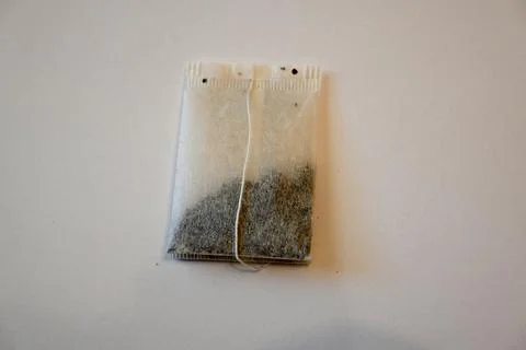 Tea Bag on White Background, Minimal Beverage Concept with Copy Space 库存照片