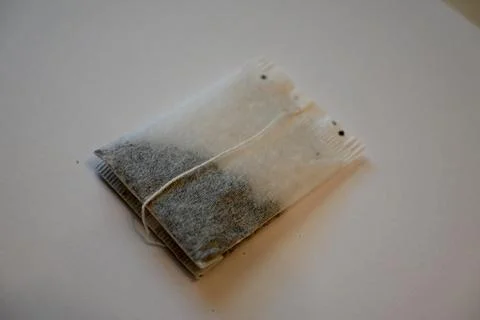 Tea Bag on White Background, Minimal Beverage Concept with Copy Space Photos