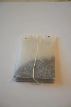 Tea Bag on White Background, Minimal Beverage Concept with Copy Space Photos