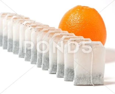 Tea bags and orange Stock Photos