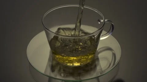 Tea being poured into glass tea cup Stock Footage 55846075