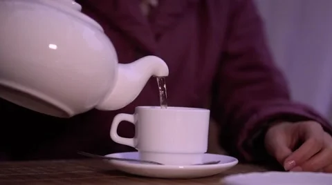 Tea being poured into tea cup Stock Footage 68410183
