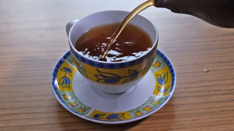 Tea being poured into tea cup. Stock Footage 113544423
