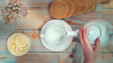 Tea being poured into tea cup Stock Footage 137225577