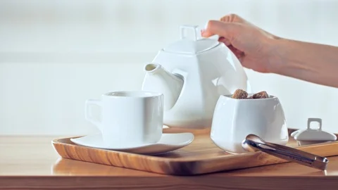 Tea being served in a white porcelain tableware Stock Footage 89651998