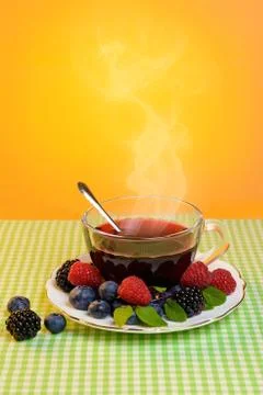 Tea with berries Stock Photos