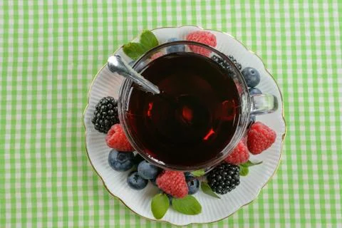 Tea with berries Stock Photos