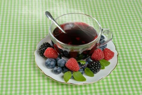 Tea with berries Stock Photos