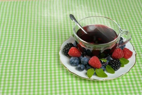 Tea with berries Stock Photos