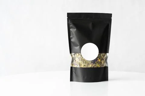 Tea Black package mockup with the tea blend inside Stock Photos