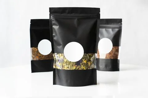 Tea Black package mockup with the tea blend inside Stock Photos