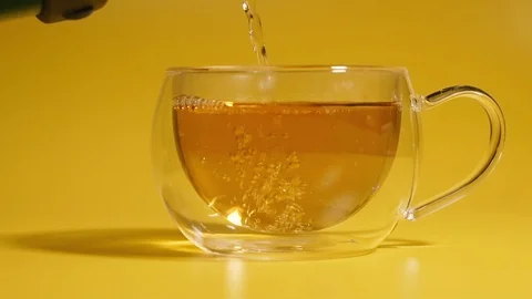 Tea. Black tea is poured into the cup. Stock Footage 124815695