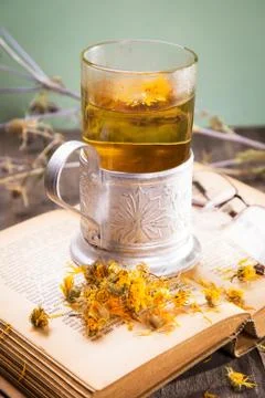 Tea on book Stock Photos