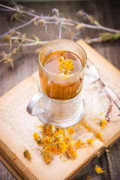 Tea on book Stock Photos