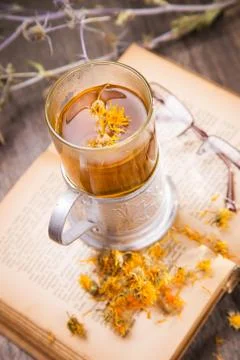 Tea on book Stock Photos