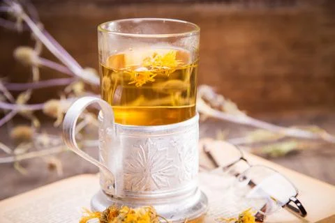 Tea on book Stock Photos