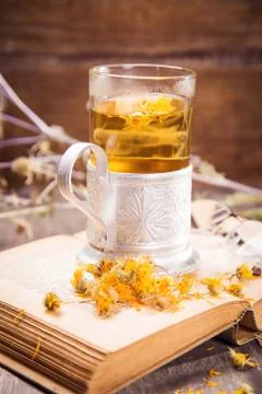 Tea on book Stock Photos