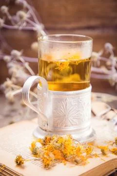 Tea on book Stock Photos