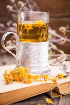 Tea on book Stock Photos