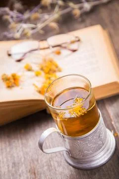 Tea on book Stock Photos