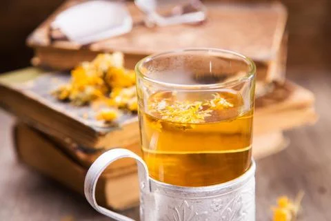 Tea on book Stock Photos
