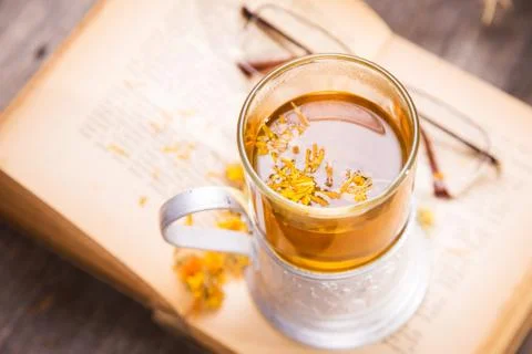 Tea on book Stock Photos