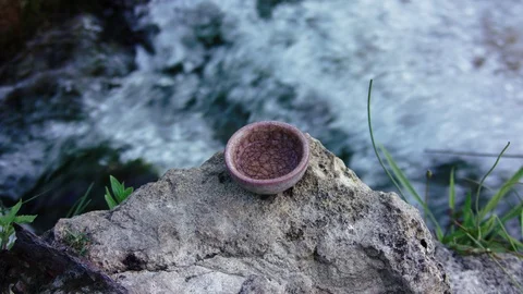 Tea bowl on stone 库存影片 94838700