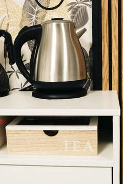 Tea box under a teapot in a cafe area Stock Photos