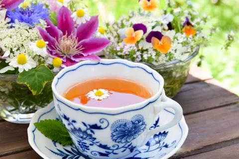 Tea break with flowers Stock Photos