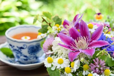 Tea break with flowers Stock Photos