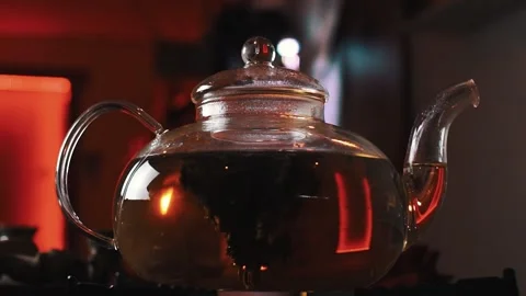 Tea is brewed in a transparent teapot Stock Footage 138439284