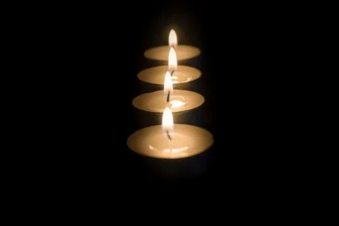 Tea candles in the dark Stock Photos