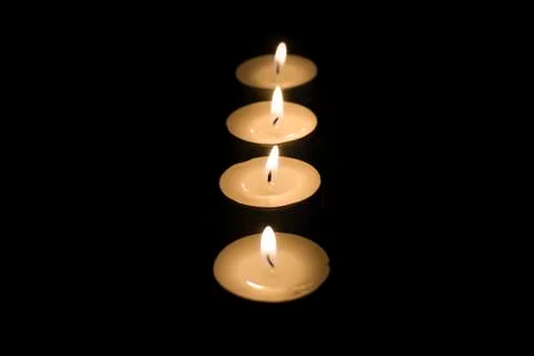 Tea candles in the dark Stock Photos