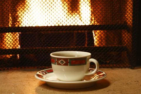 Tea cap on firepalce background Stock Photos
