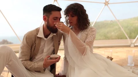 Tea ceremony at a boho wedding. Bride and groom in boho. Stock Footage 156849366