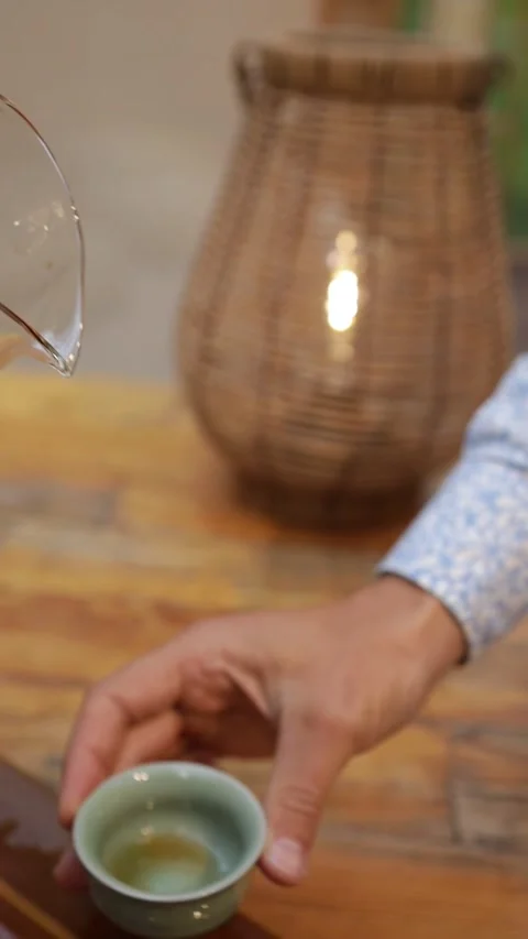 Tea Ceremony Close-Up: Pouring Hot Tea Into Cup Stock Footage 323918712